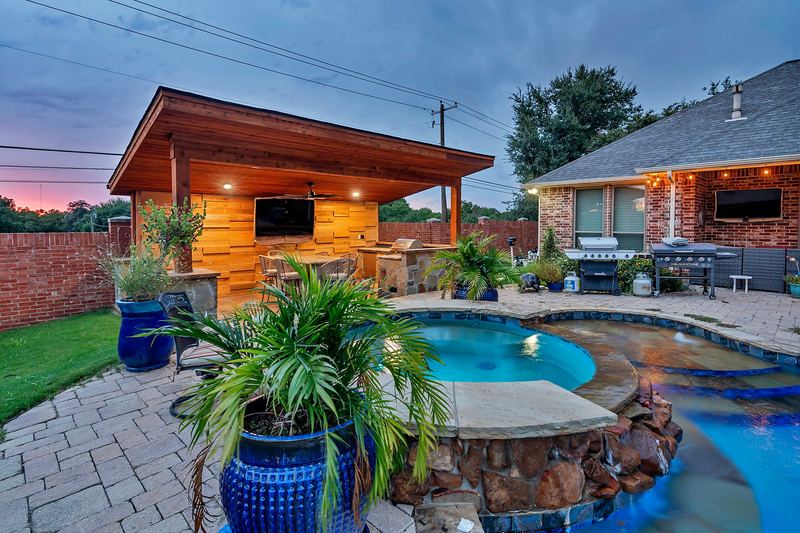 Freeform pool and cabana at sunset